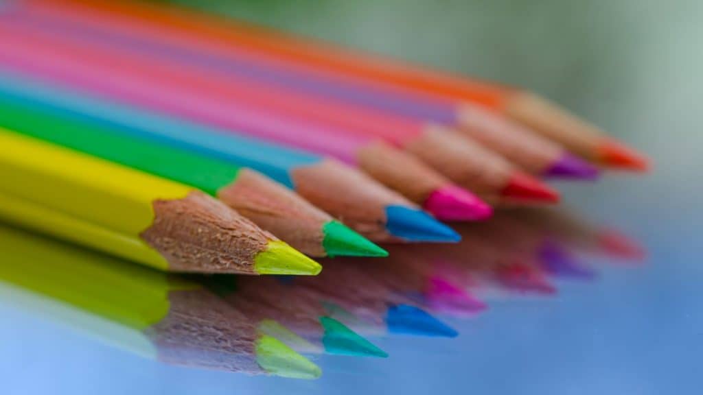 seven bright colored pencils