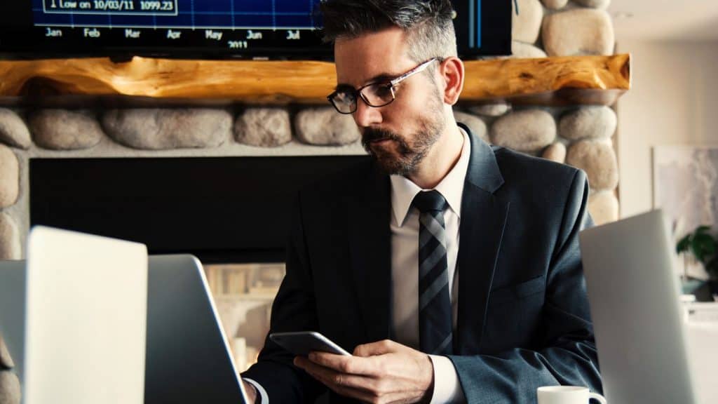 man in black working on a laptop