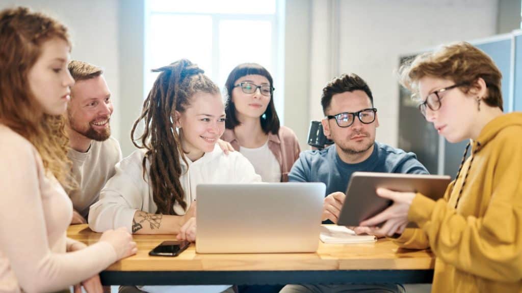 group of business people looking at a tablet