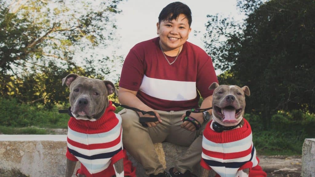 dogs and owner wearing matching shirts