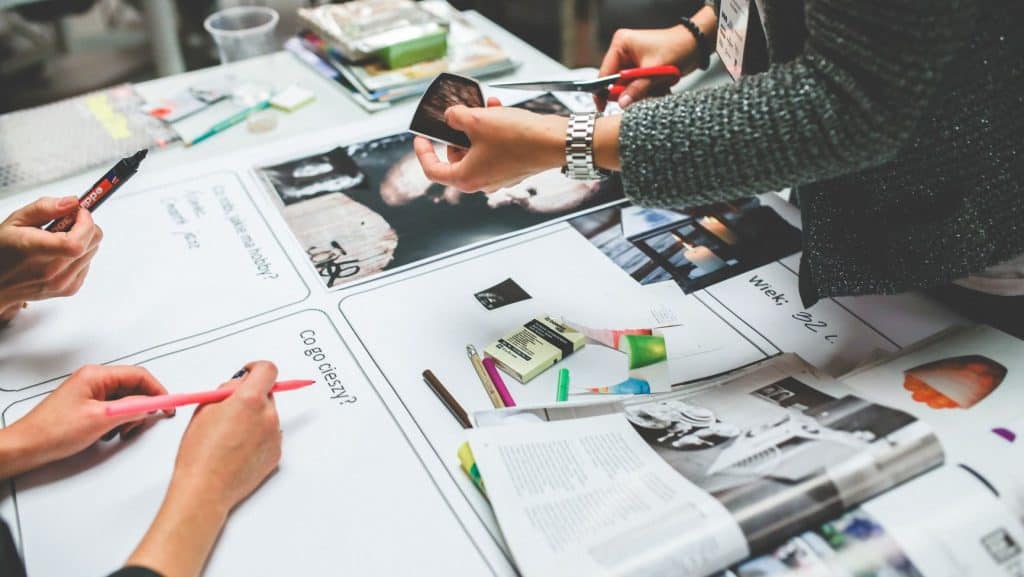 designers working on a brand strategy on a white table
