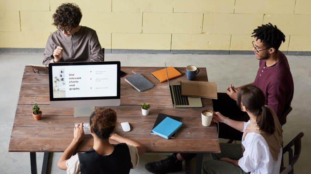 group of business people working on their brand at a table