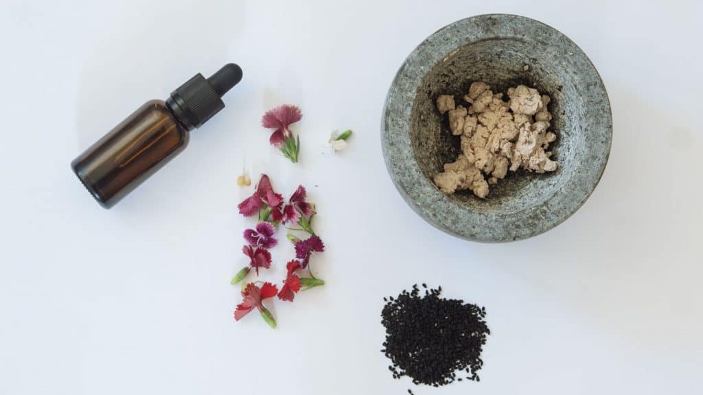 seeds flower bottle and mortar