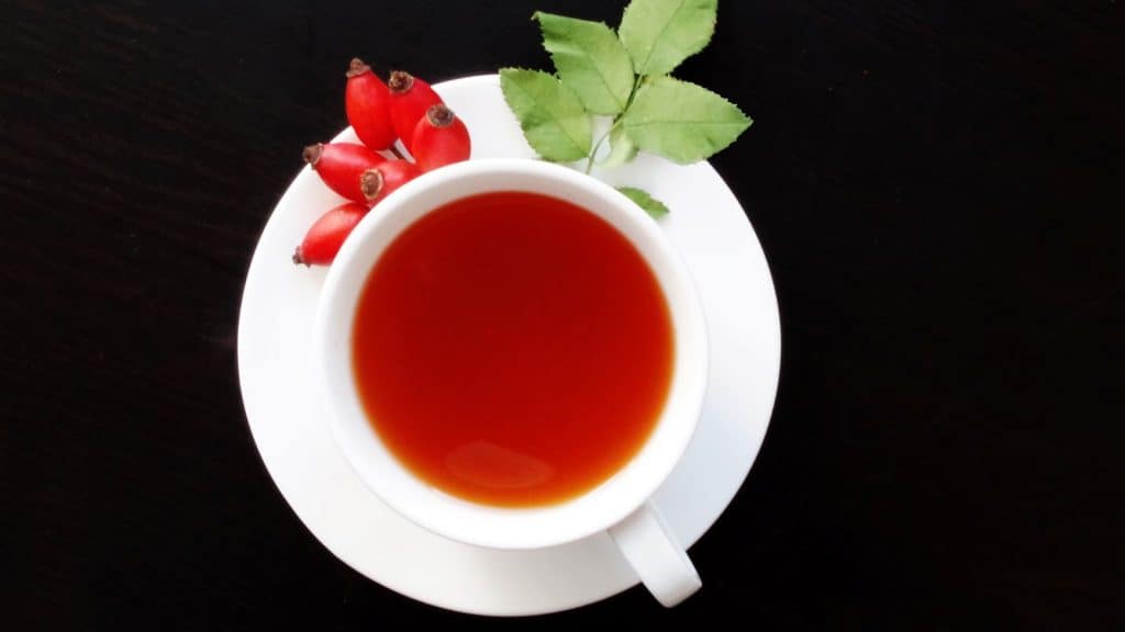 red herbal tea in a white mug