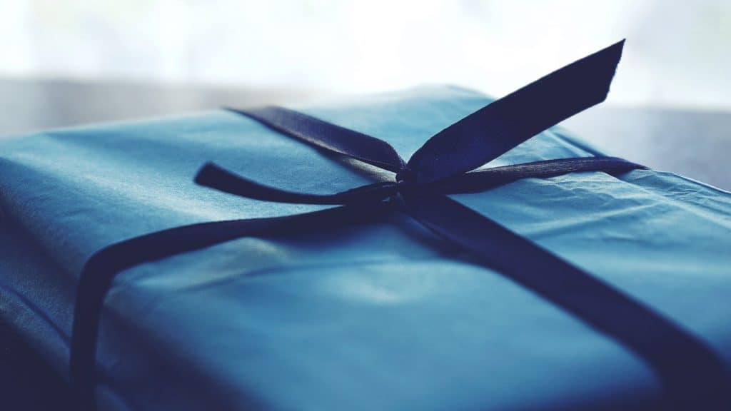 close up of package wrapped in blue reusable cloth