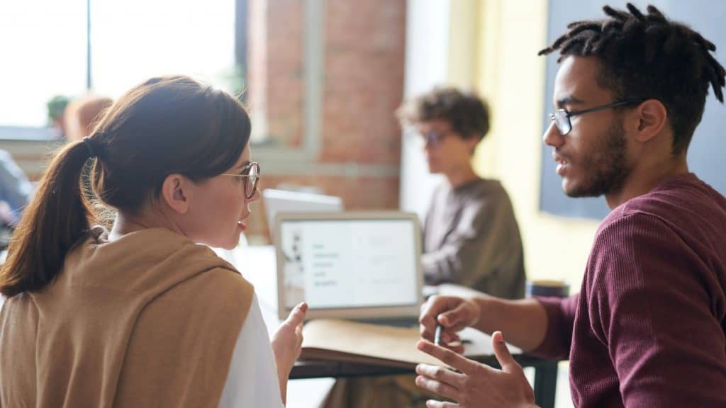 business man talking to his coworker