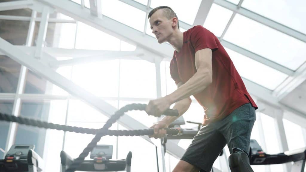 man exercising in red shirt