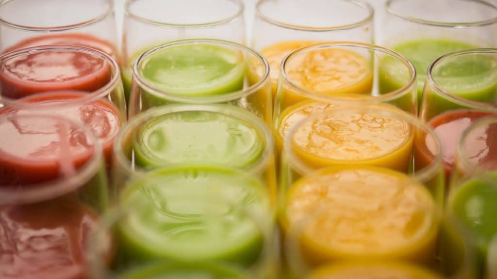 assortment of smoothies sitting on a table