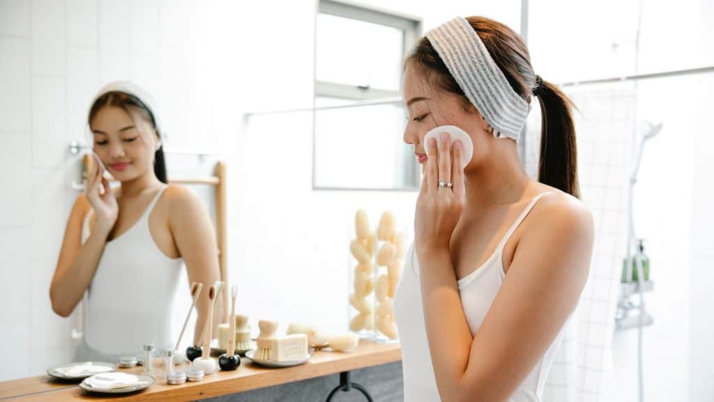 woman using skincare packaging