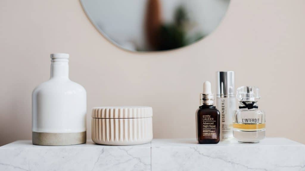 skincare products next to a mirror