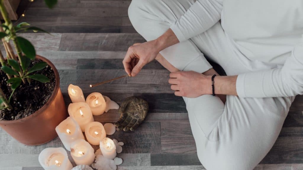 person meditating on starting a candle business