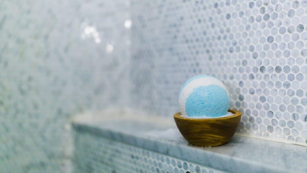 blue bath bomb on bathroom counter