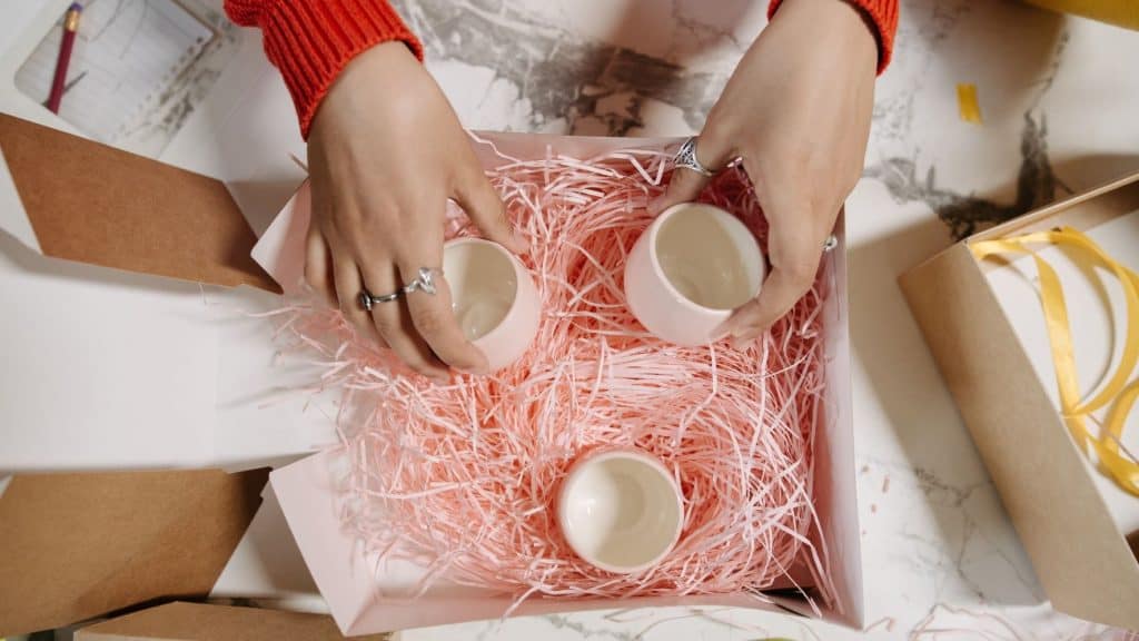 woman putting mental health products into packaging