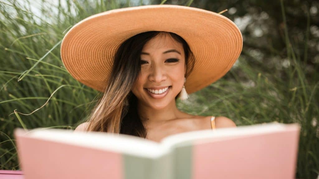woman reading mental health book