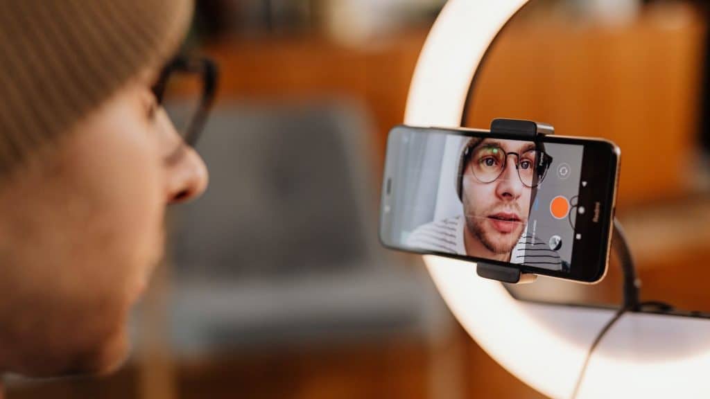 skincare entrepreneur filming a video