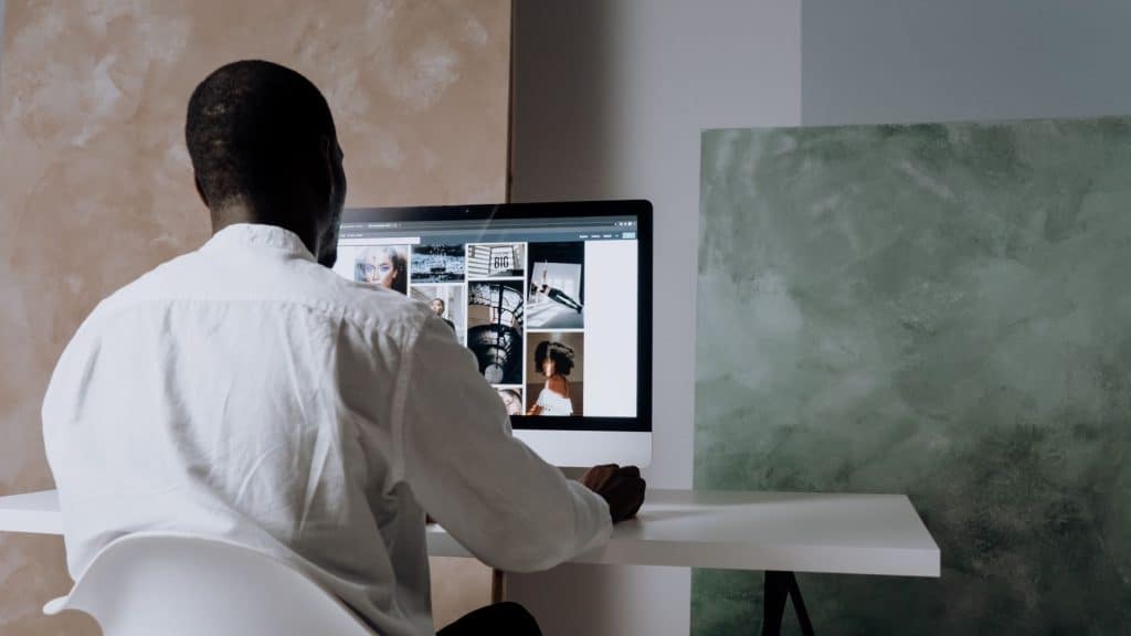 man designing a website for a wellness center