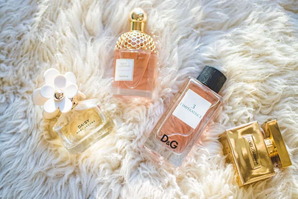 luxury perfume packaging on white shag carpet background