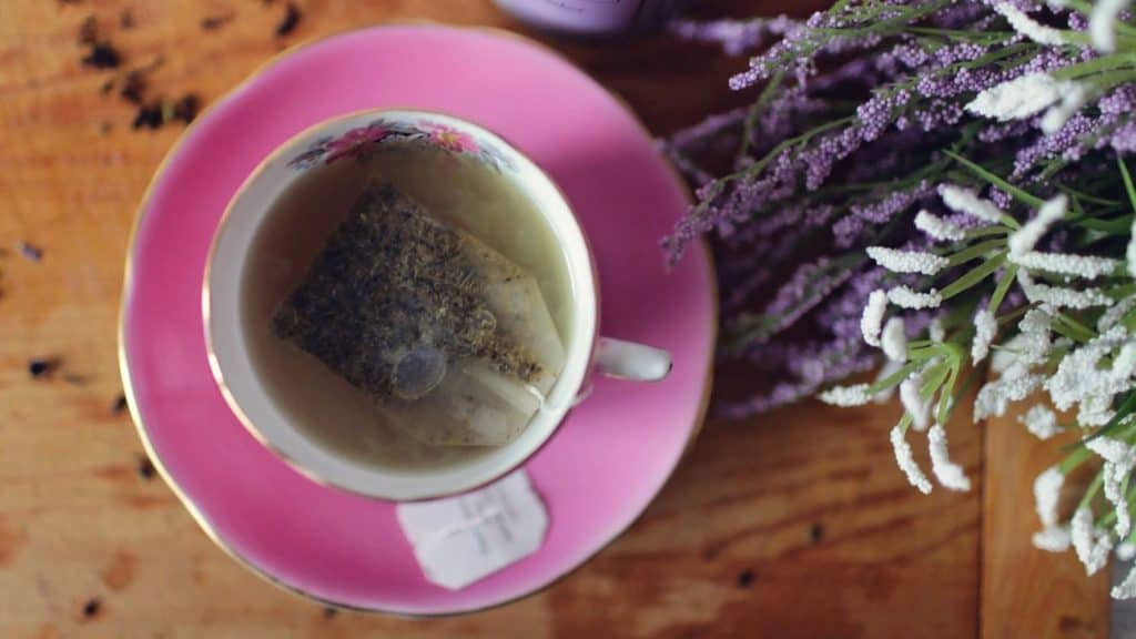 tea branding and packaging on a pink saucer