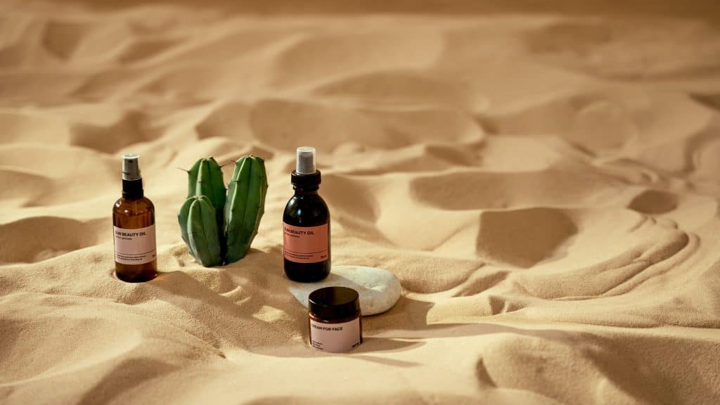 packaging for skin care products in sand