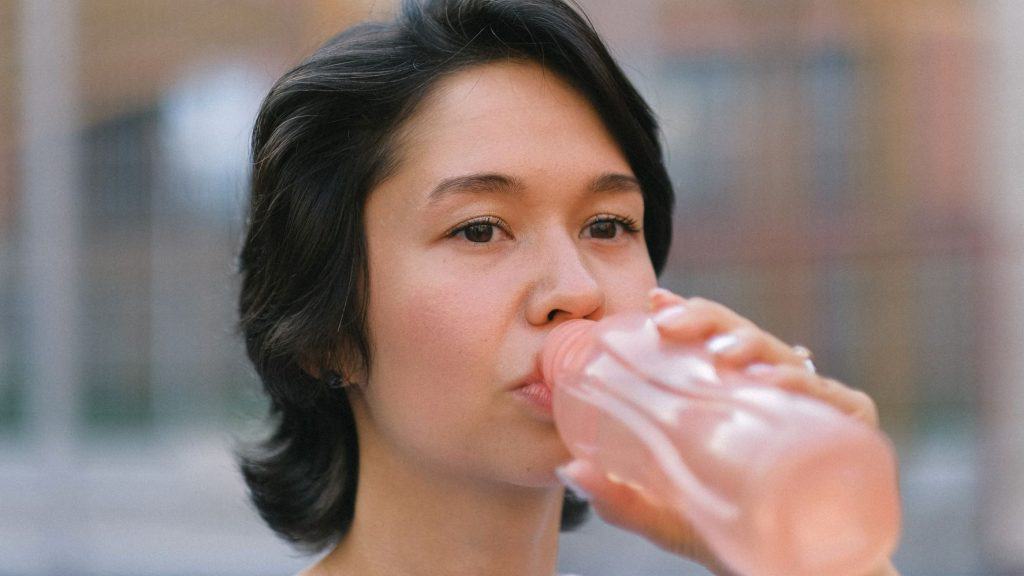 woman holding drinks packaging design