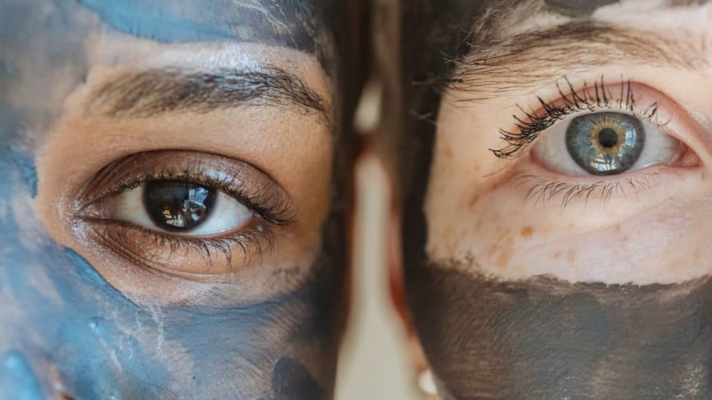two women wearing skincare face masks