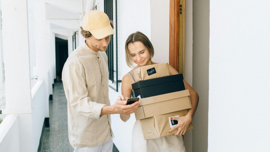 Satisfied customer receiving her delivered products