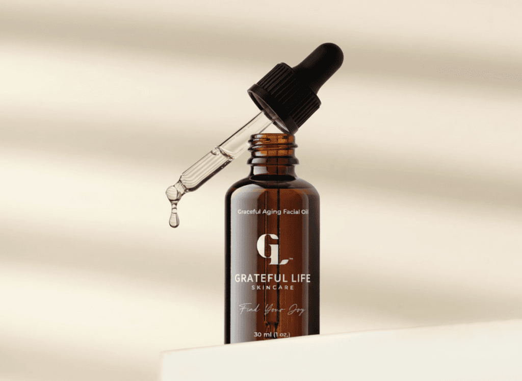 Minimal serum bottle design with amber glass and clean label typography, close-up product photography featuring dropper and liquid detail in a soft neutral setting
