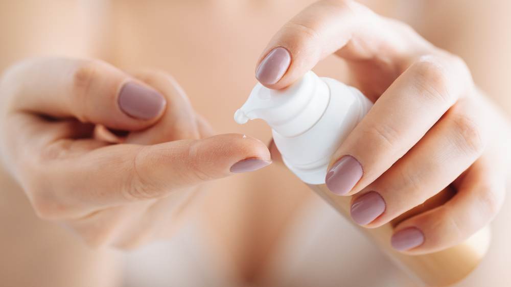 Skincare serum on hand